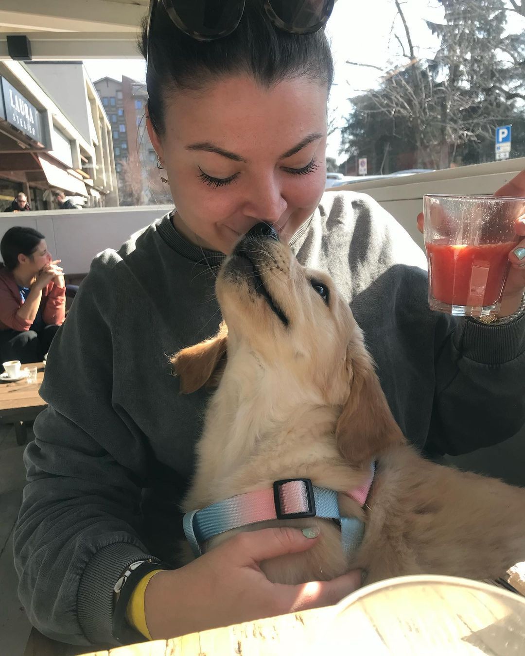 Happy family with their retriever puppy