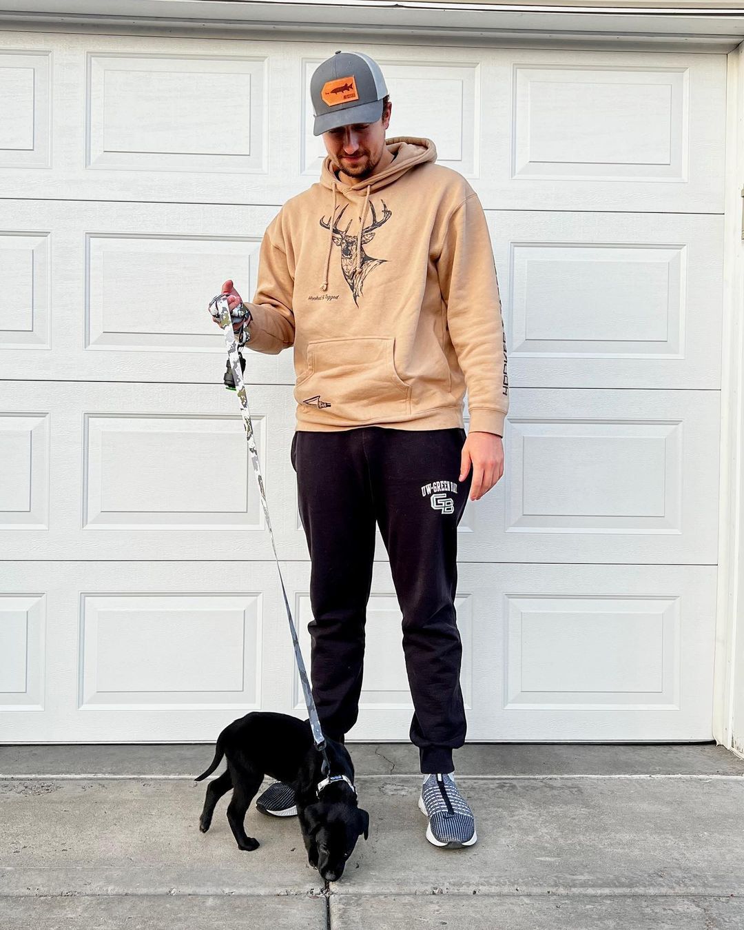 Happy family with their retriever puppy