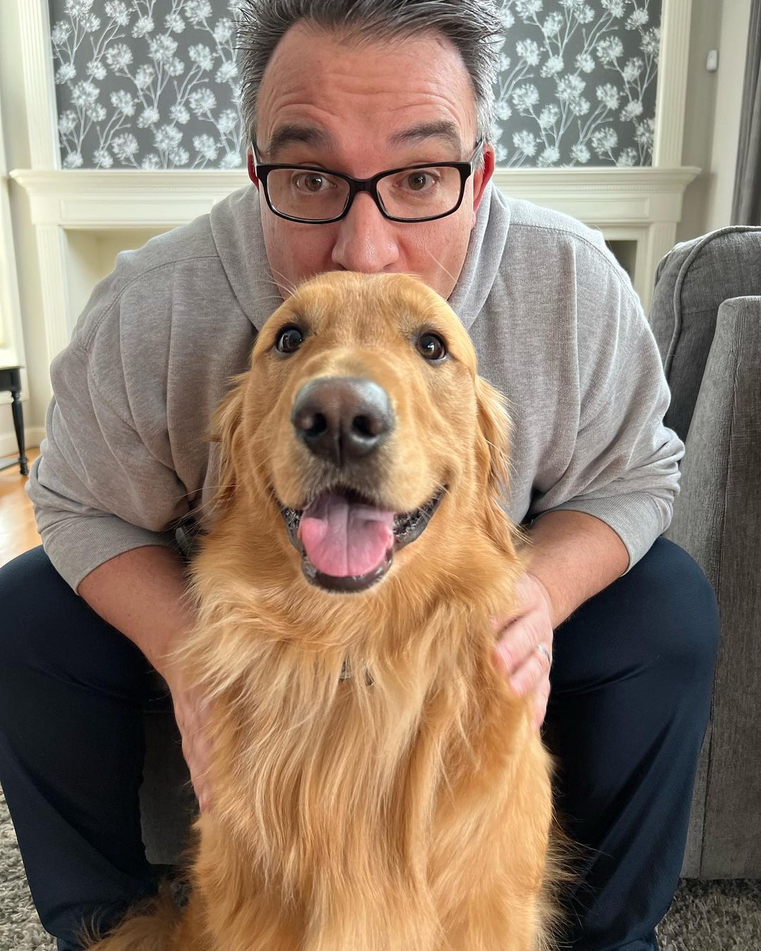 Happy family with their retriever puppy
